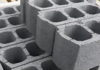 Molde de bovedilla de concreto con dos bloques al pie como muestra